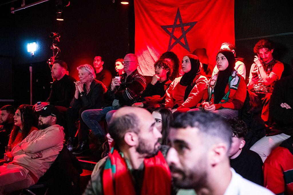 Café match night Morocco Netherlands World Cup fans together screen atmosphere community shared moment