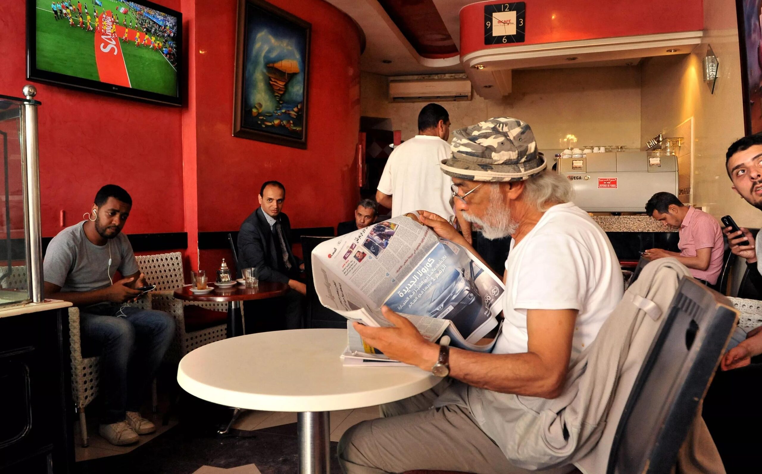 Cafes morning newsrooms Morocco fans discussion penalty win Netherlands tactical analysis breakfast coffee