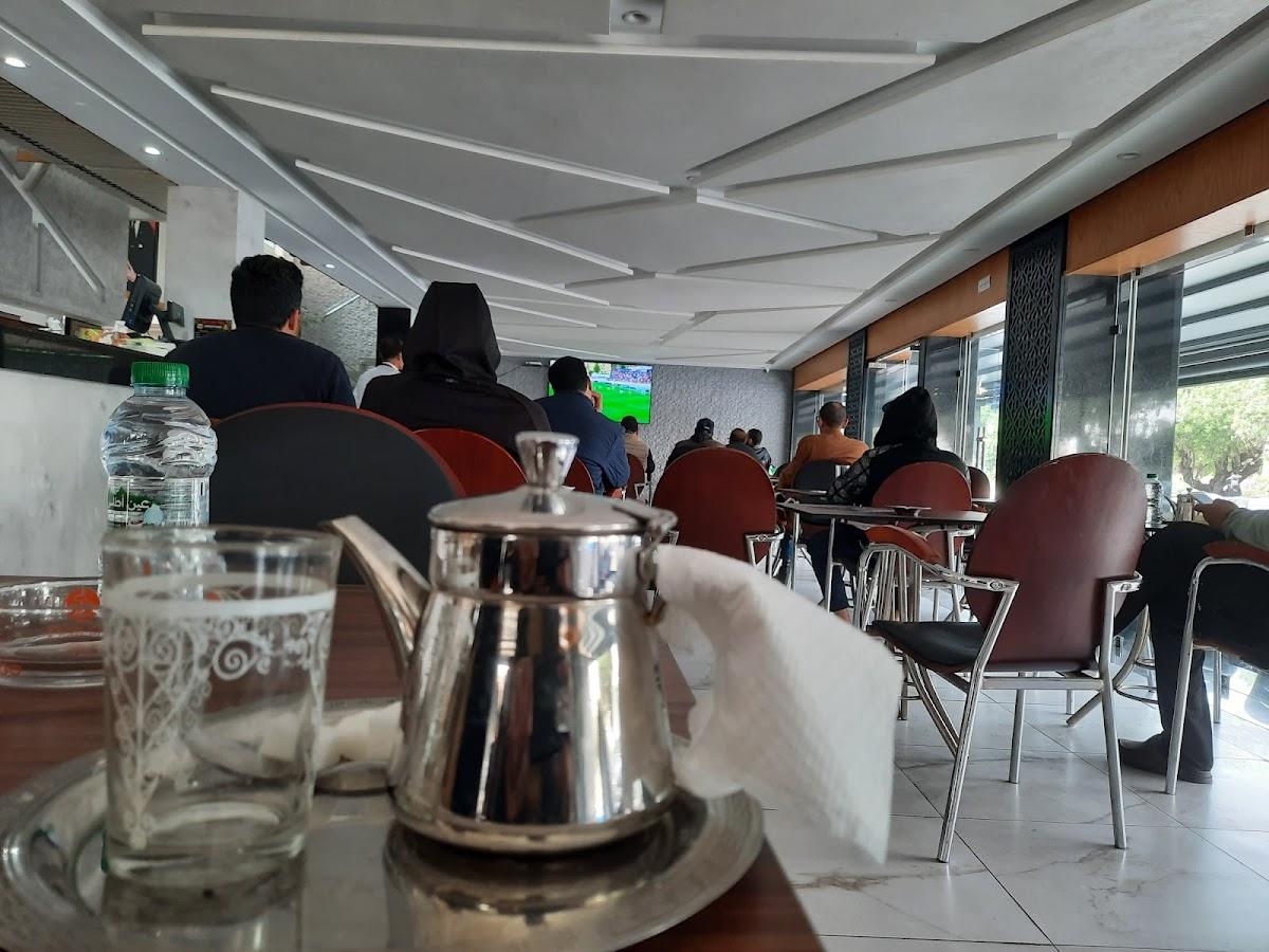 Cafes morning stadiums Morocco fans gathering coffee replay clips Netherlands penalty victory atmosphere