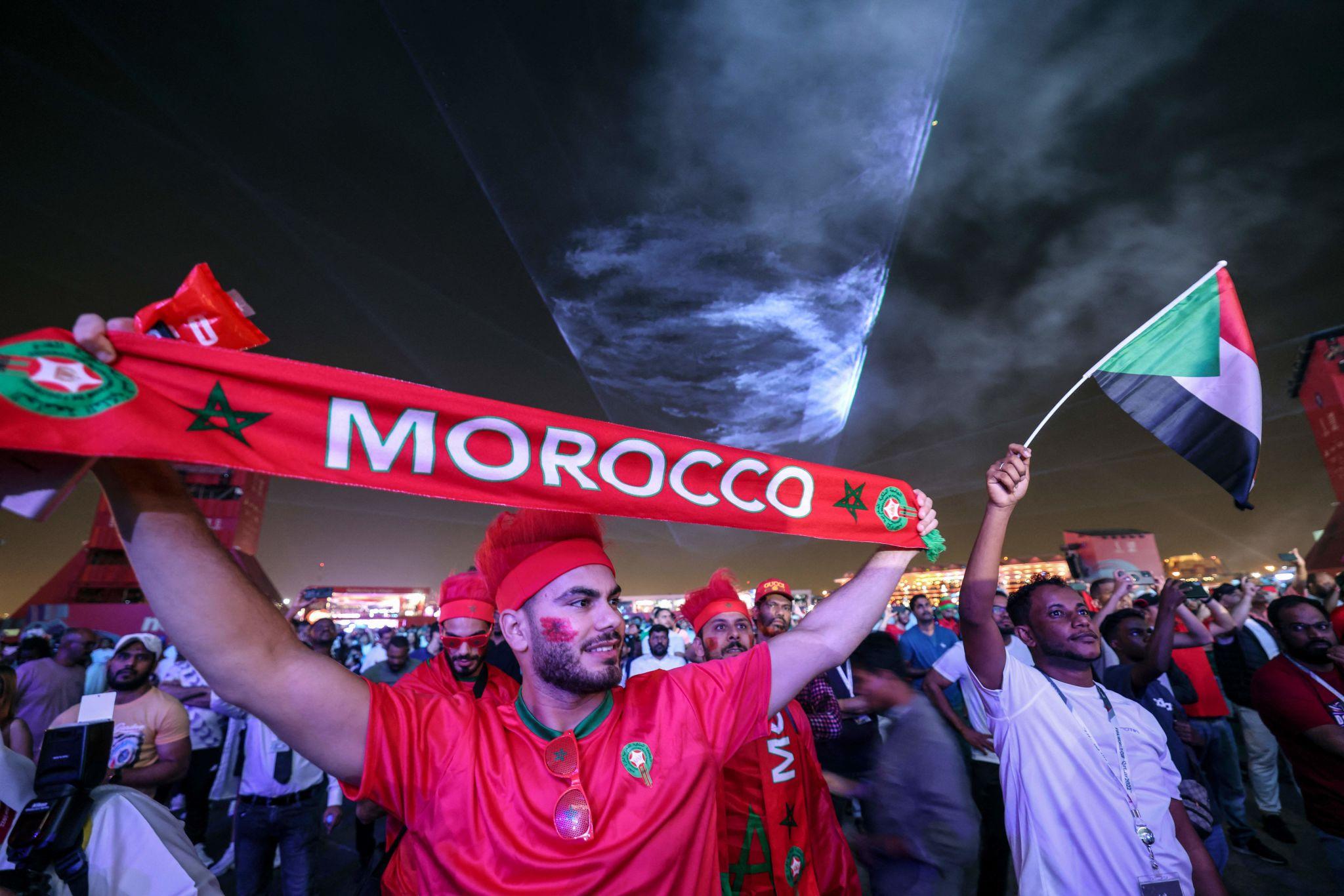 Moroccan fans World Cup image red shirts flags songs 2022 Qatar Atlas Lions presence identity
