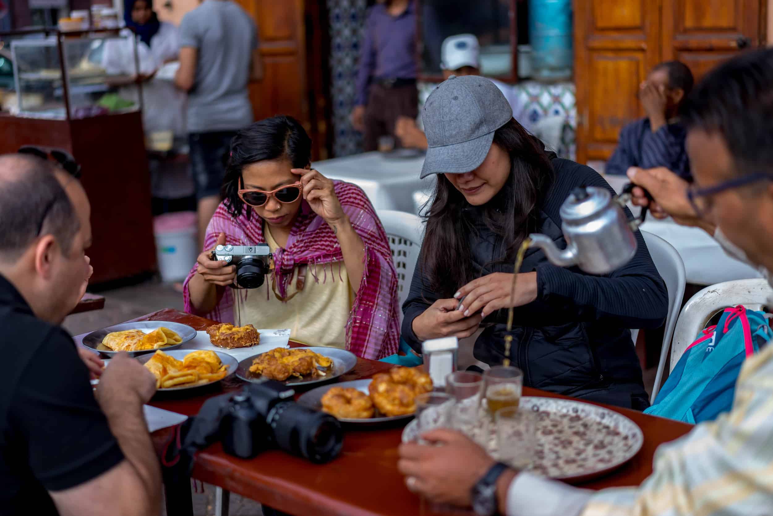 Jemaa el-Fnaa square in Marrakech owning Morocco's street food drama with smoke, crowds and nightly theatre