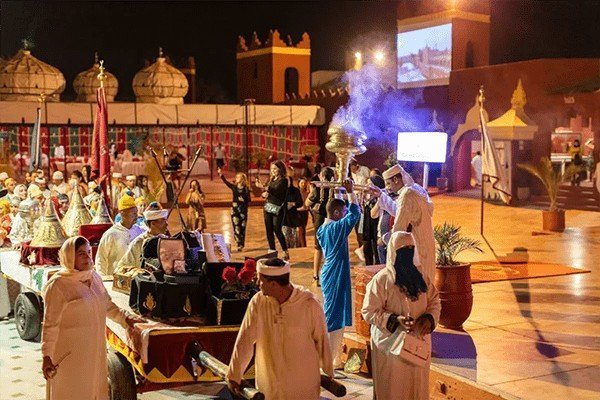 Tourists love Morocco mint tea performance pour from height silver pot glass colourful social media