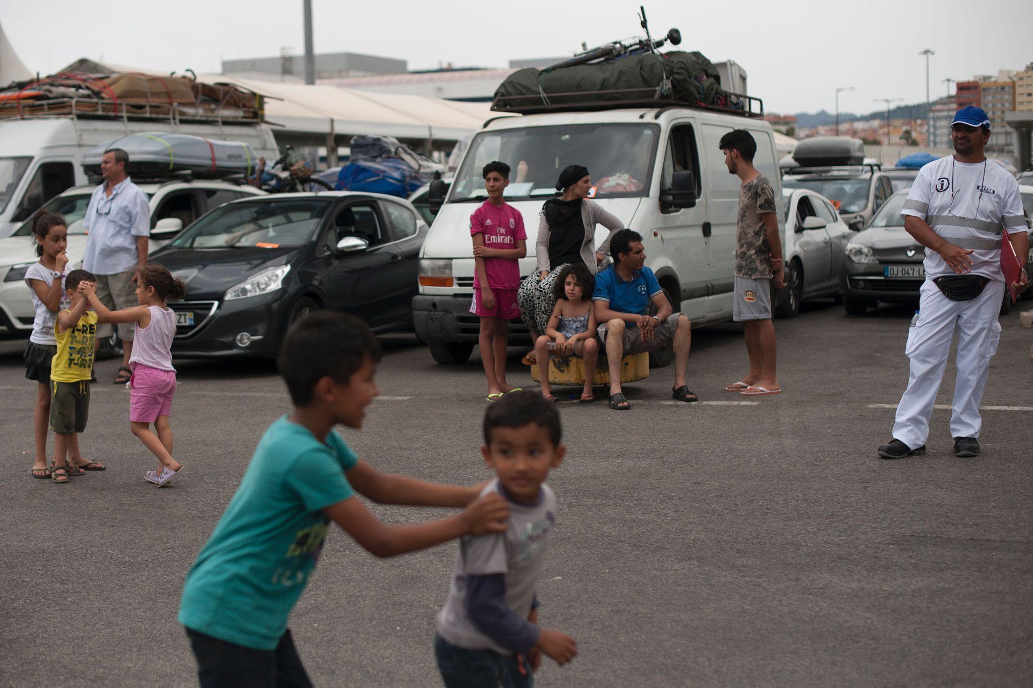 Diaspora families travelling to Morocco by car with luggage, children and household belongings