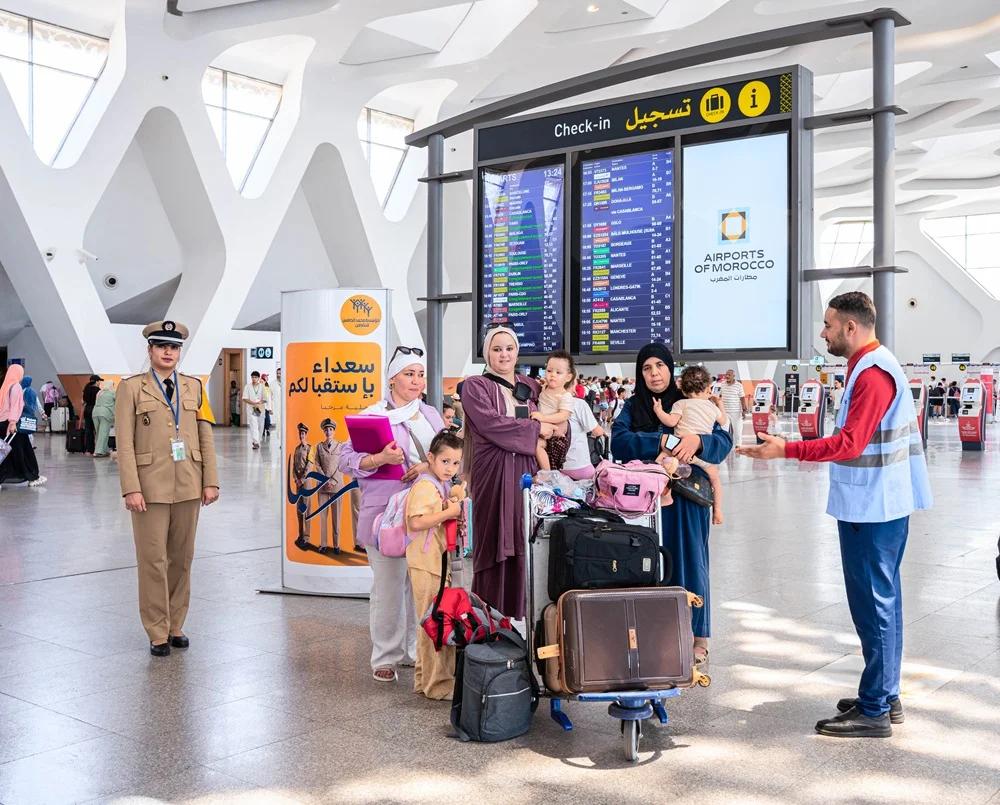 Moroccan diaspora families comparing flight prices and route safety before summer travel