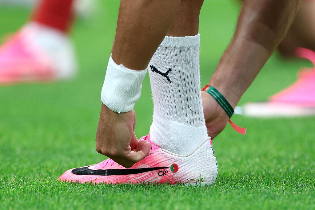 Pink boots screen TV football viral close-up camera green grass colour contrast TikTok Instagram clip