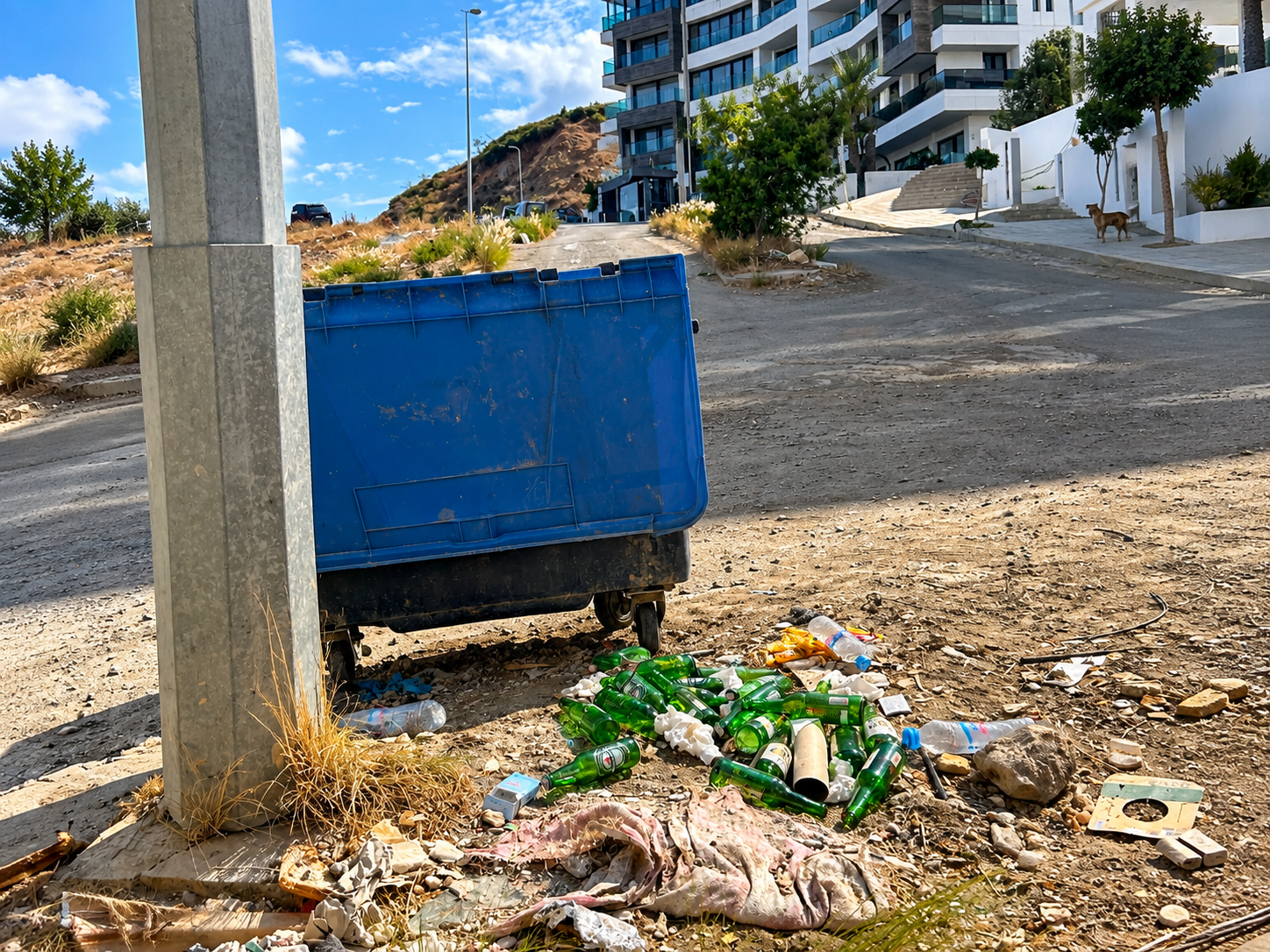 Broken glass and construction rubble near residences in Malabata Hills, Tangier, Morocco